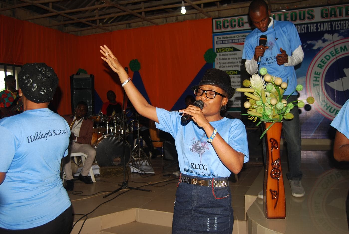 Members of the choir singing together indoors.