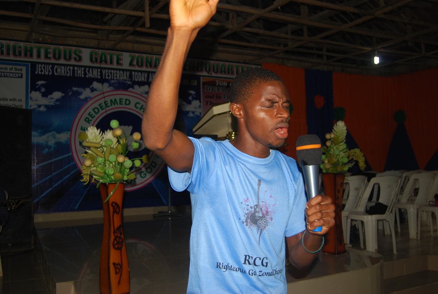 A soloist singing into a handheld microphone.