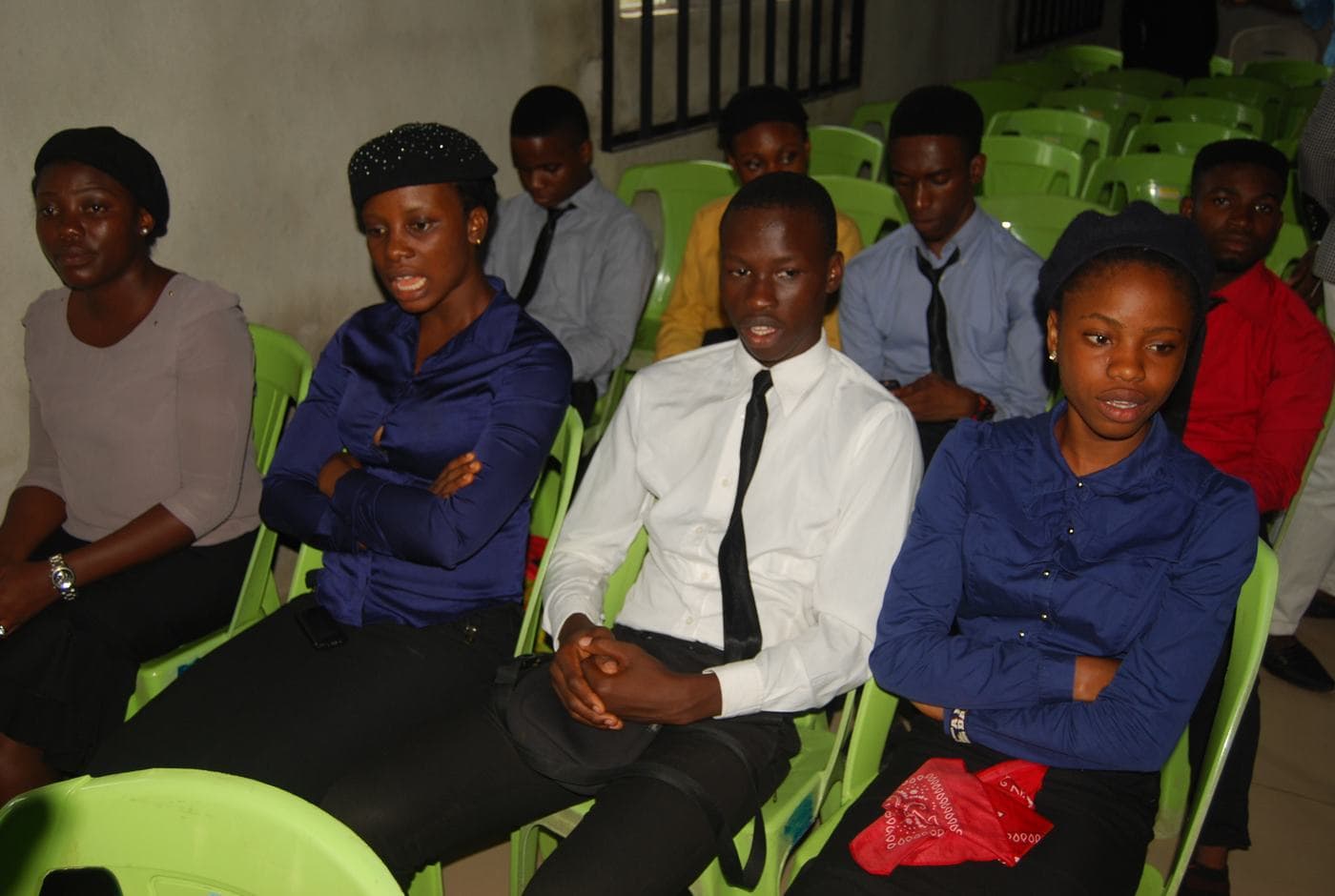 Members of the choir singing together indoors.