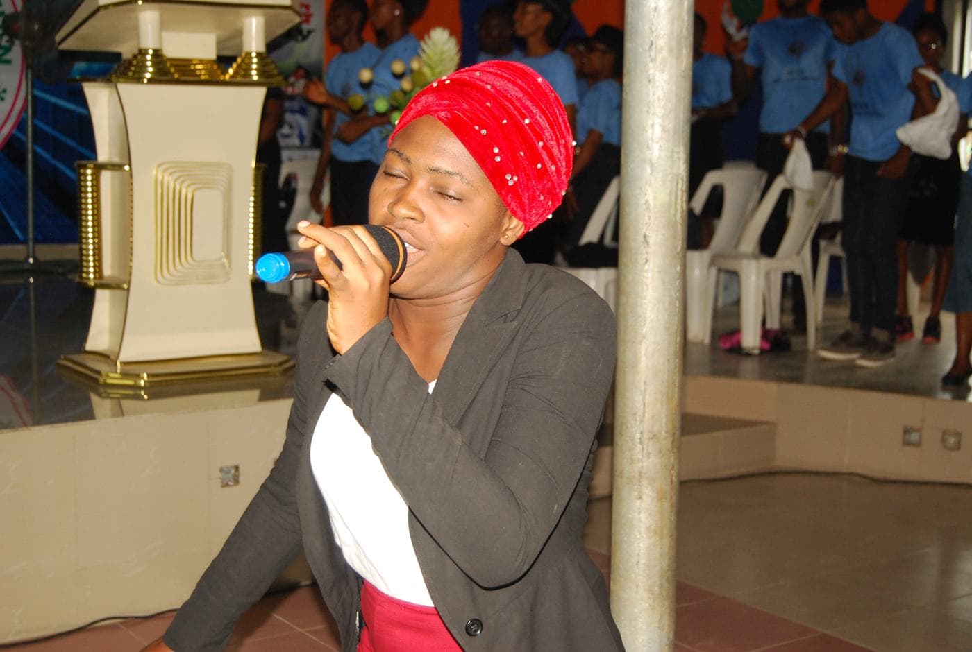 A member of the congregation seated, listening.
