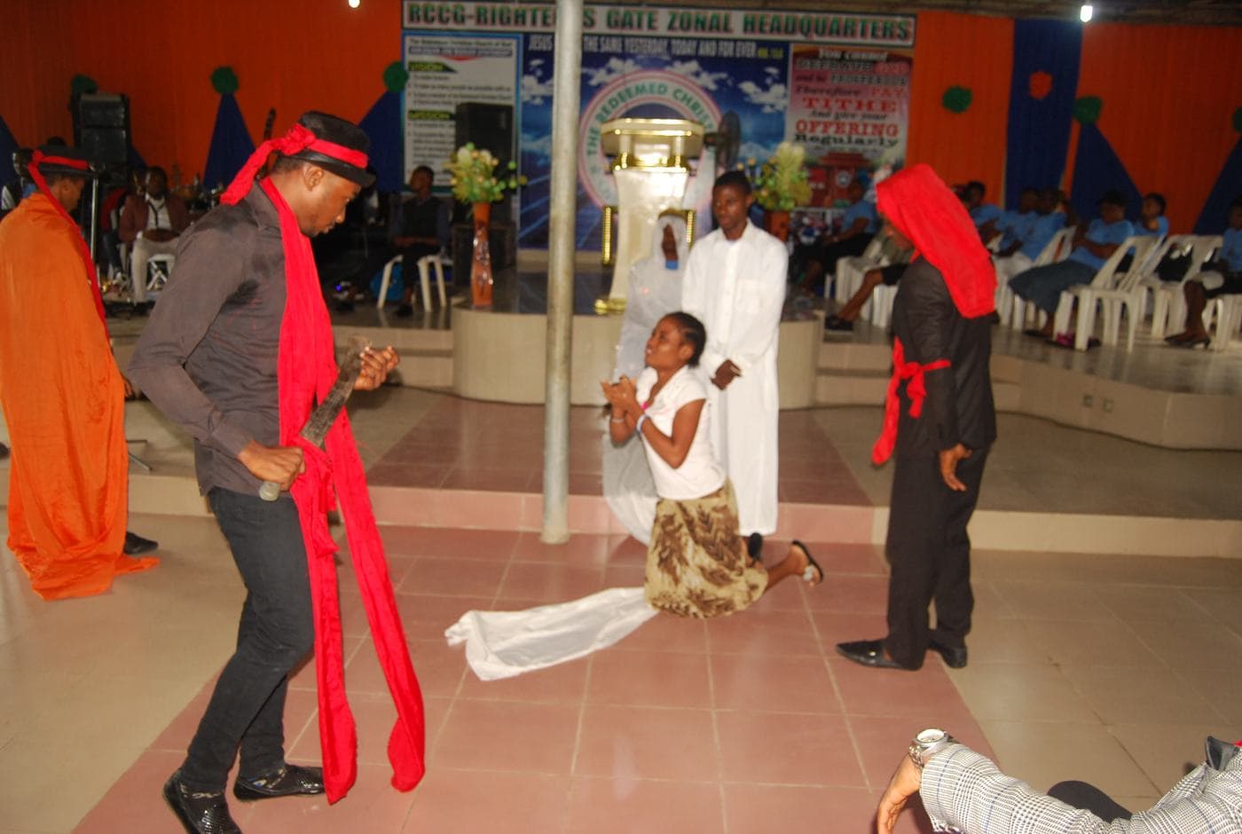 Members of the choir singing together indoors.