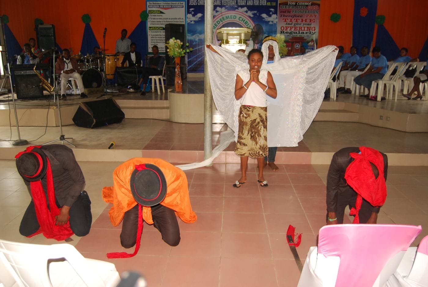 A member of the congregation seated, listening.
