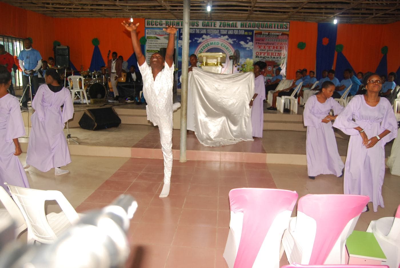 Members of the choir singing together indoors.