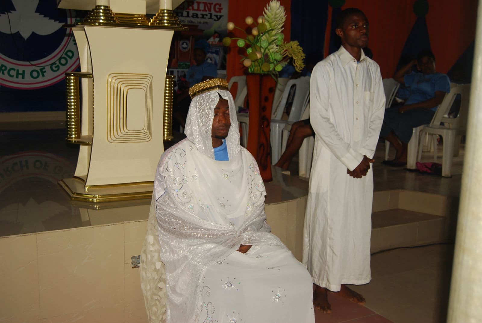 A staged nativity presentation, in white and gold.