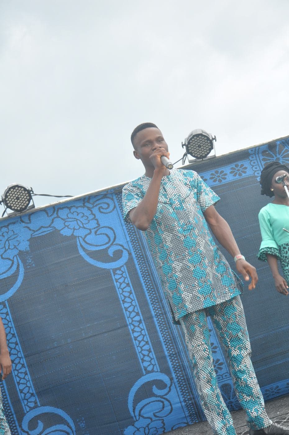 A candid moment between two members of the company.