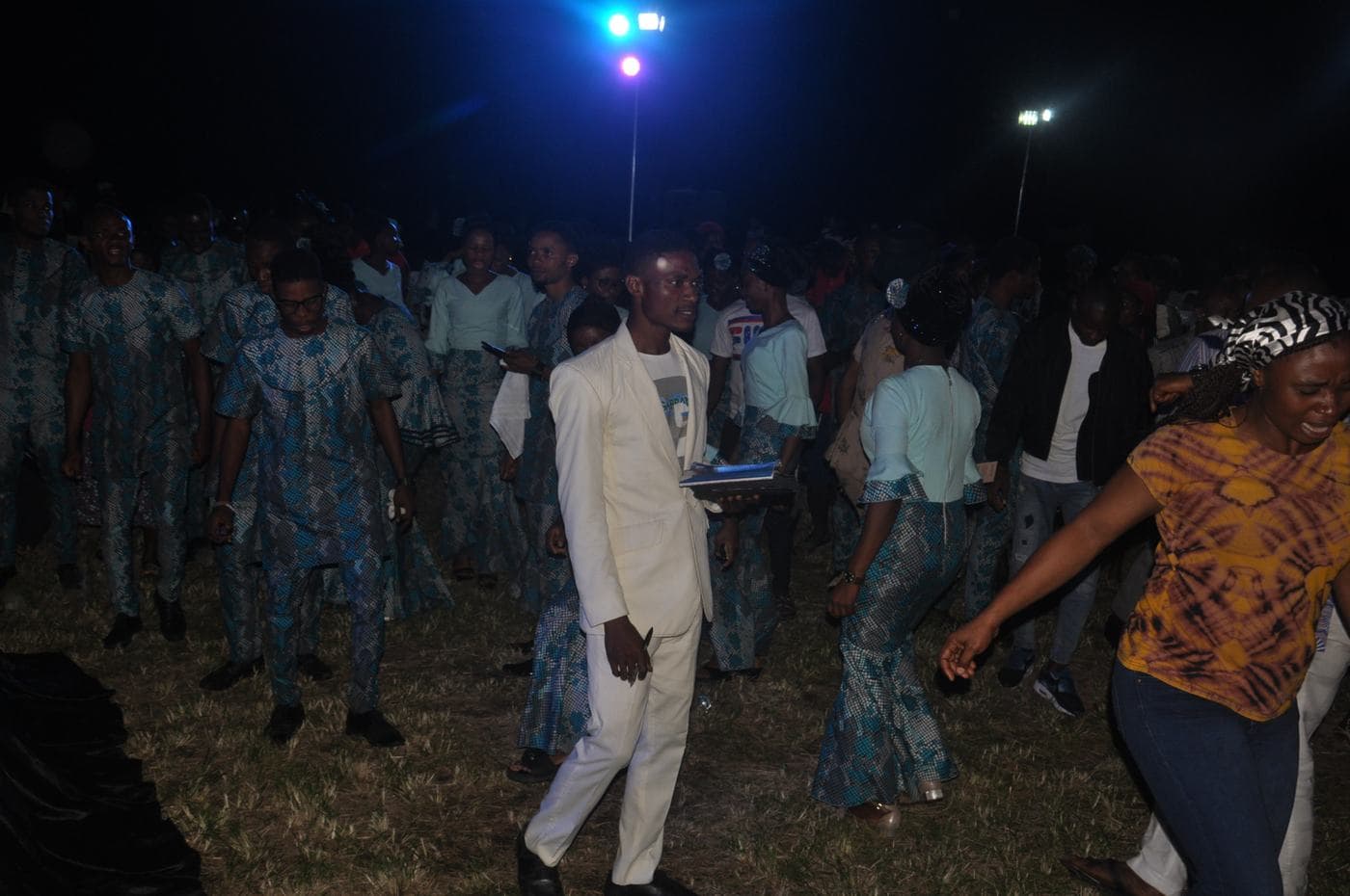 The choir gathered together on the field.