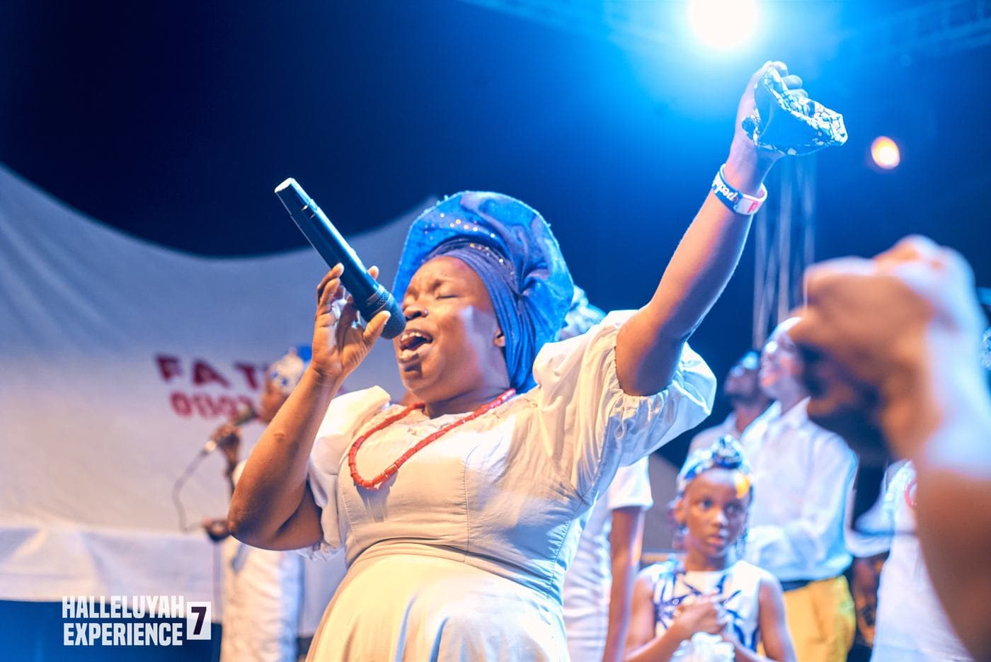 The choir performing in matching gold and white.