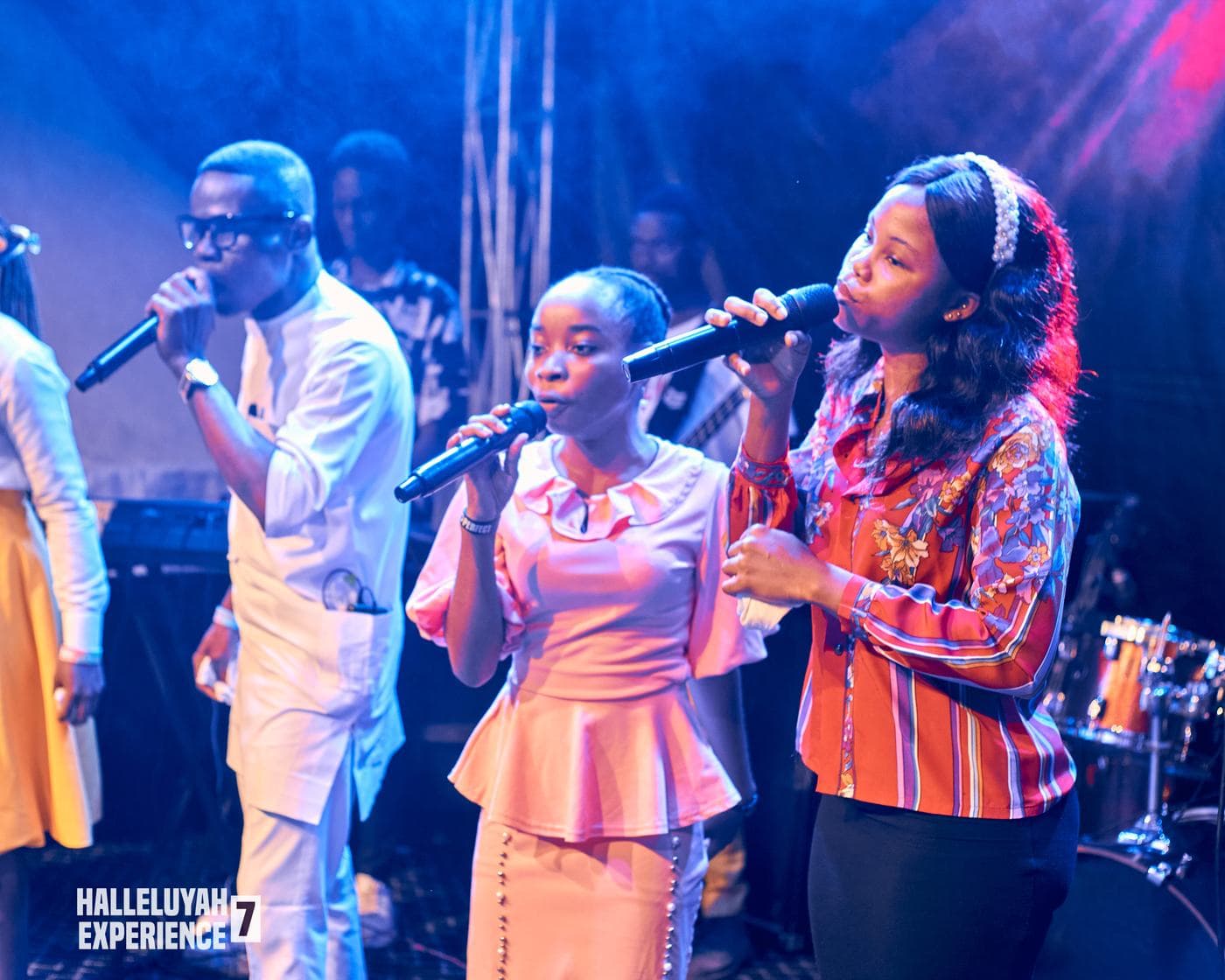 The choir performing in matching gold and white.