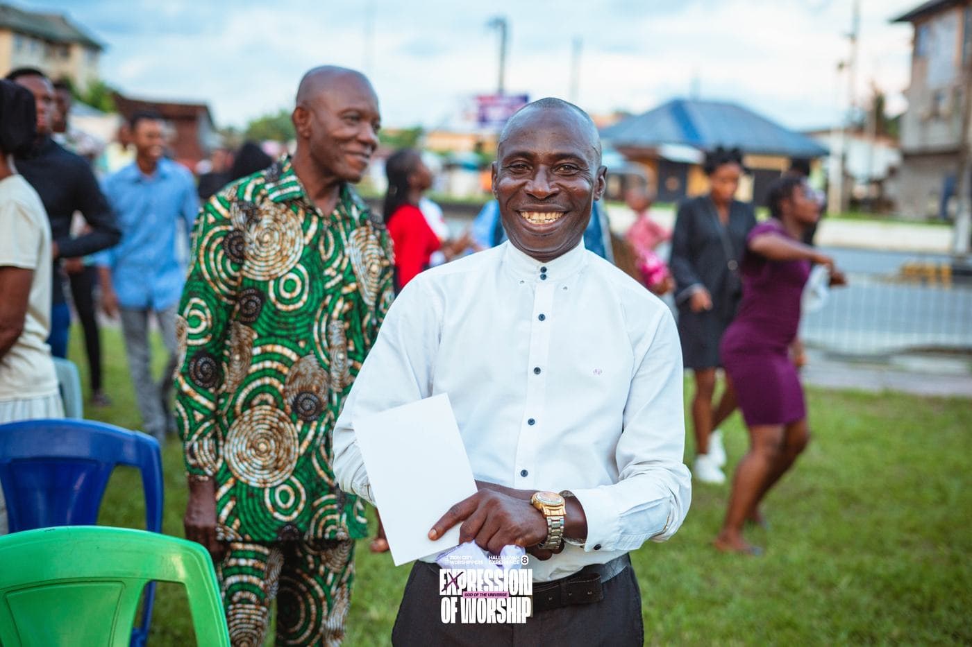 A worshipper with a hand raised.