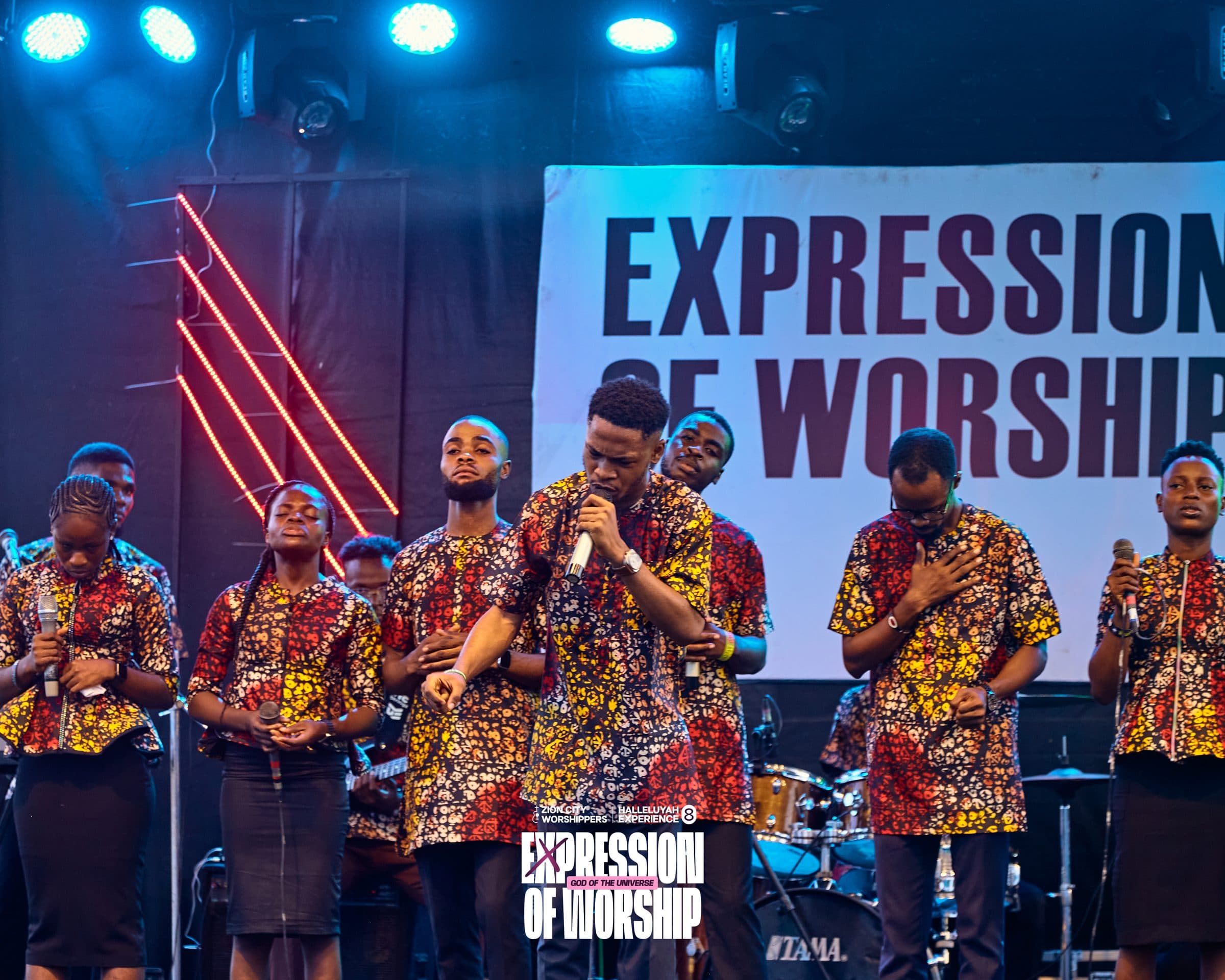 The choir performing beneath the "Expression of Worship" stage backdrop.