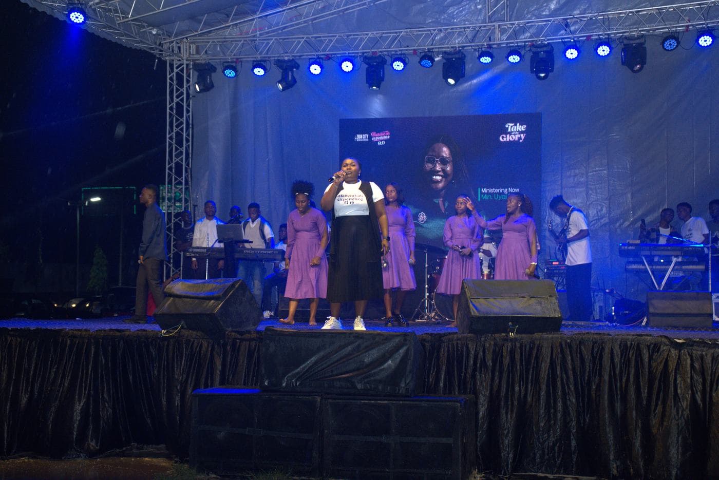 A member of the band performing on stage.
