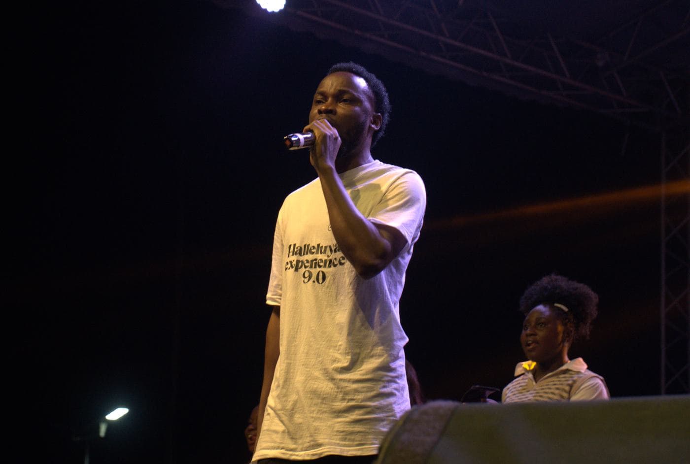 A member of the band performing on stage.