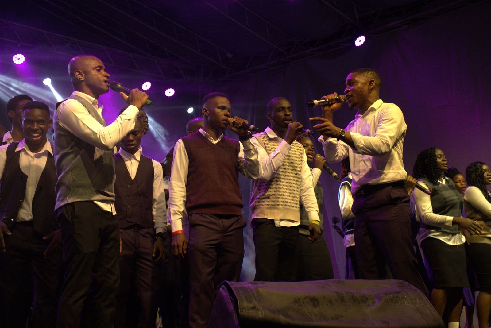 The full choir performing together on stage.