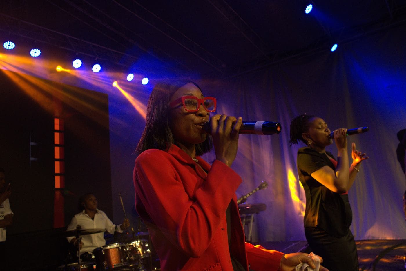 A member of the band performing on stage.