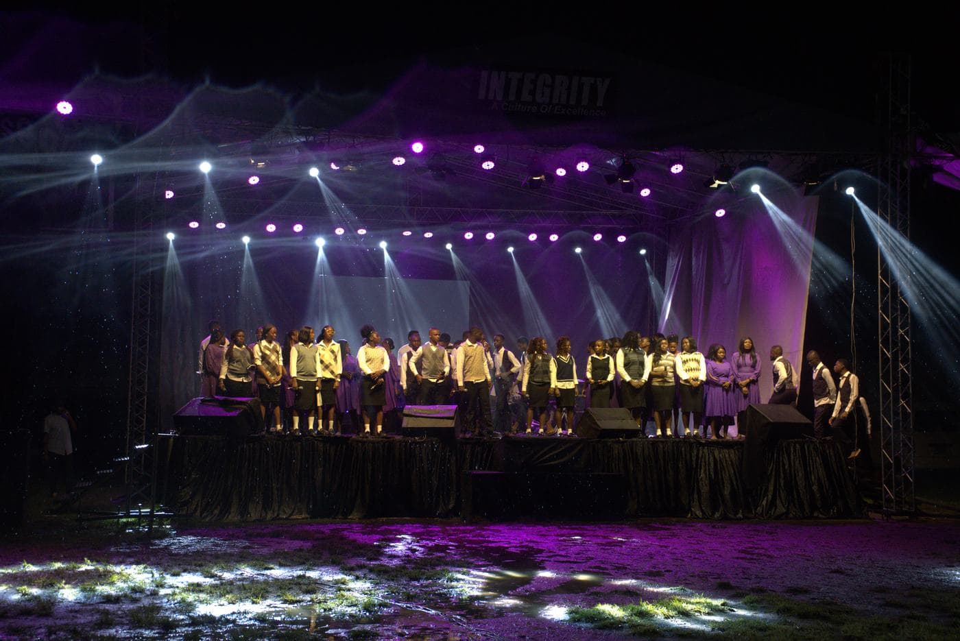 The full company gathered on stage.