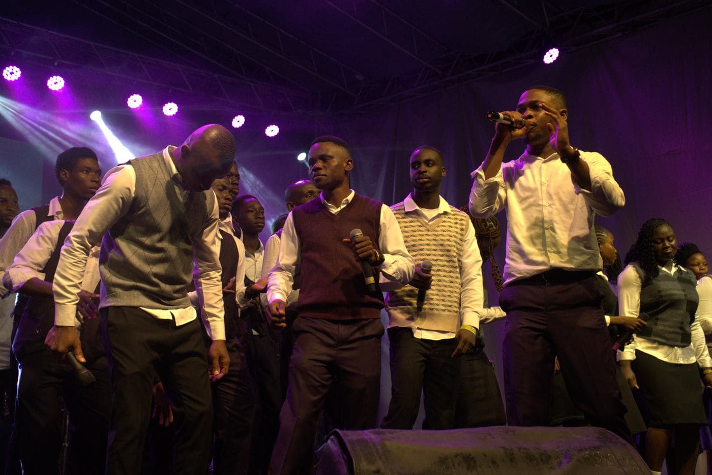 A member of the band performing on stage.